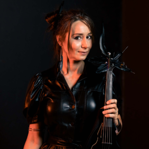 Genevieve violinist holding her violin in one hand