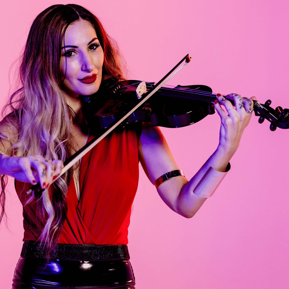 female violinist playing her violin, wearing a red shirt