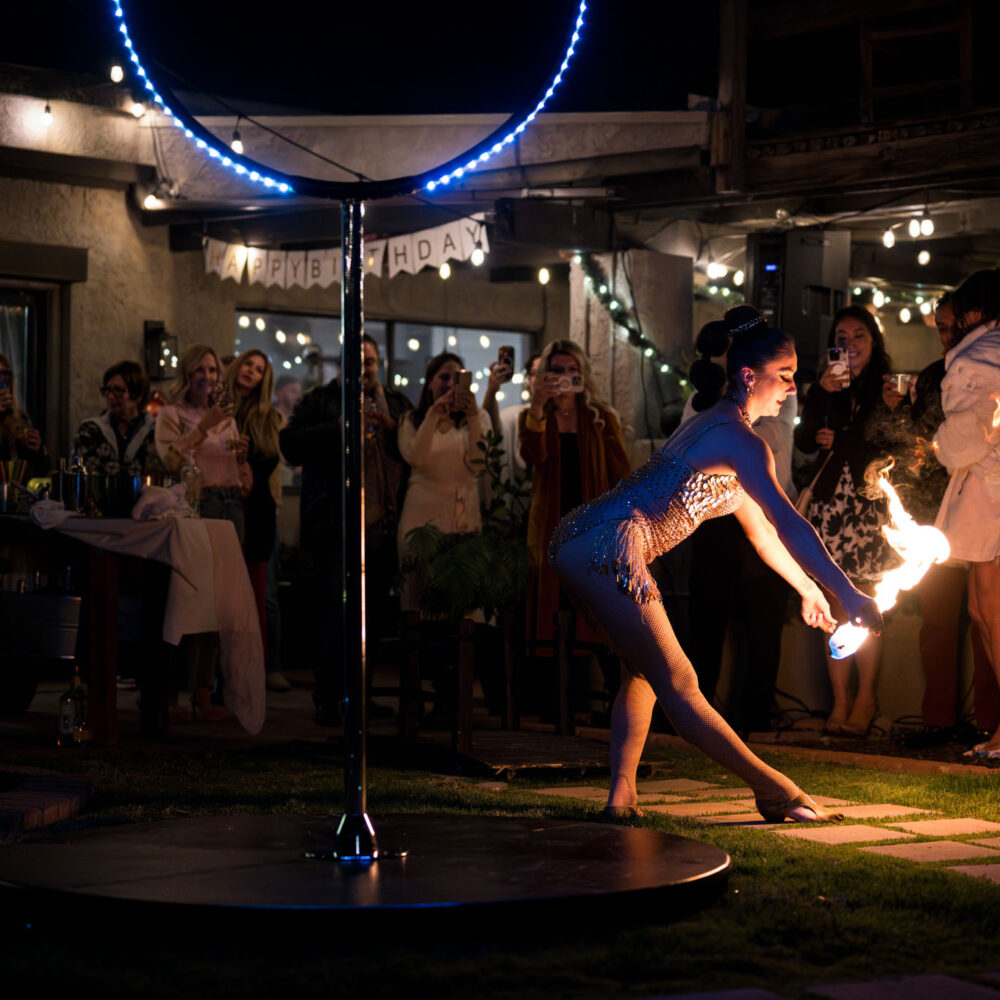 Fire dancer Skylar at an evening corporate event